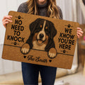 Person holding a Bernese Mountain Dog doormat featuring a friendly dog portrait and paw prints