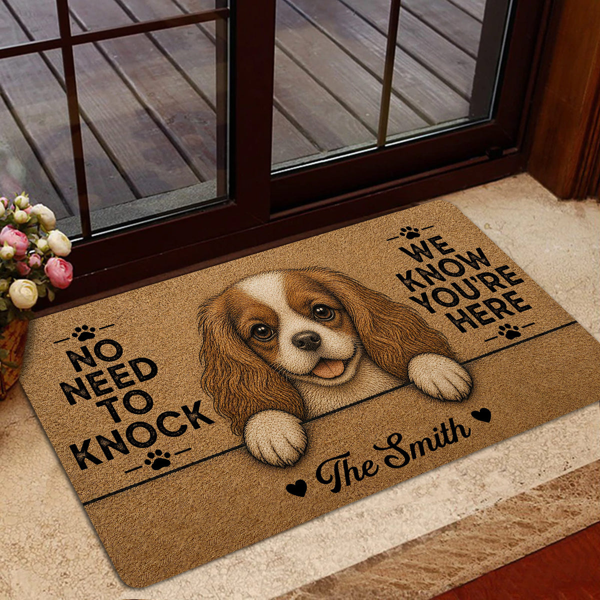 Cavalier King Charles Spaniel doormat displayed in a home entrance with a playful dog-themed design