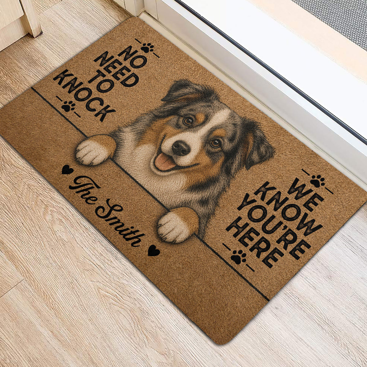 Australian Shepherd door mat styled at an indoor entrance with wood flooring and a bright doorway