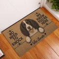 English Springer Spaniel entryway rug displayed in front of a white door on a wood floor