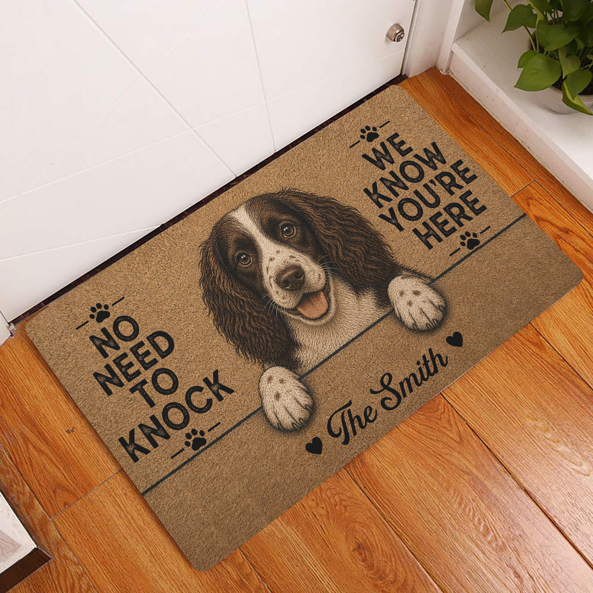 English Springer Spaniel entryway rug displayed in front of a white door on a wood floor