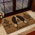 English Springer Spaniel doormat styled by a glass entry door with warm home decor