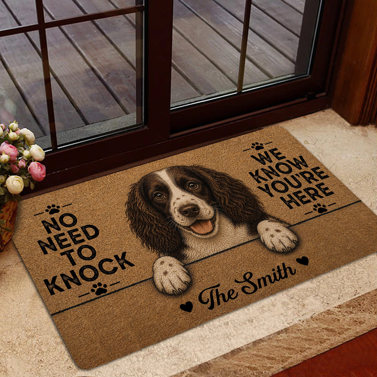 English Springer Spaniel doormat styled by a glass entry door with warm home decor