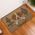 Brittany Spaniel door mat displayed at a home entrance on warm wood flooring