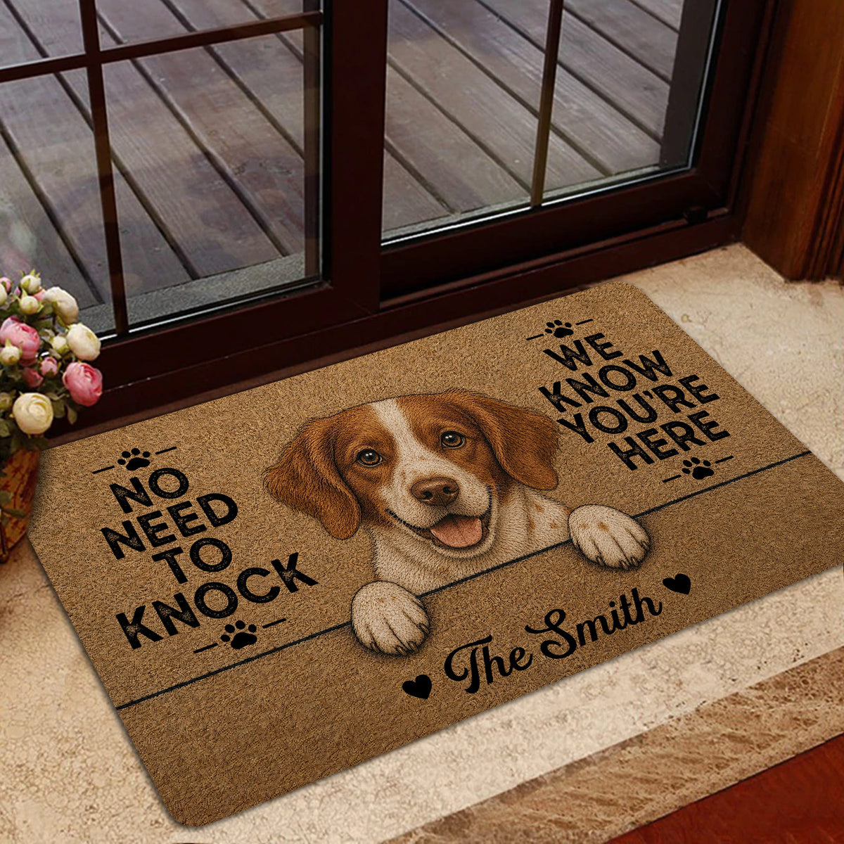 Brittany Spaniel doormat styled inside a home entrance near glass doors and flowers
