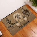 Lhasa Apso entryway rug displayed on a wood floor beside a door with a long-haired dog portrait