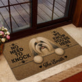 Lhasa Apso doormat displayed by a glass entry door with warm brown artwork and a playful dog message