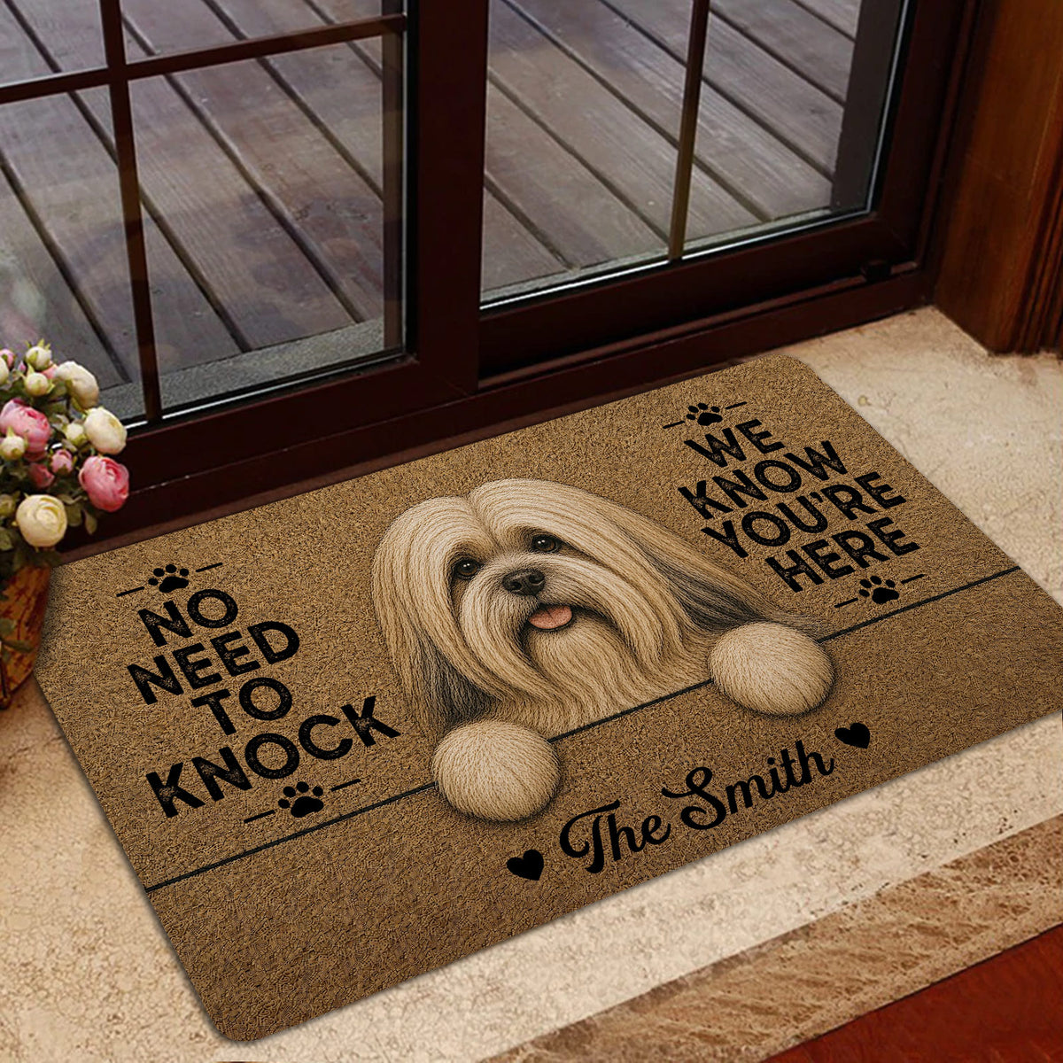 Lhasa Apso doormat displayed by a glass entry door with warm brown artwork and a playful dog message