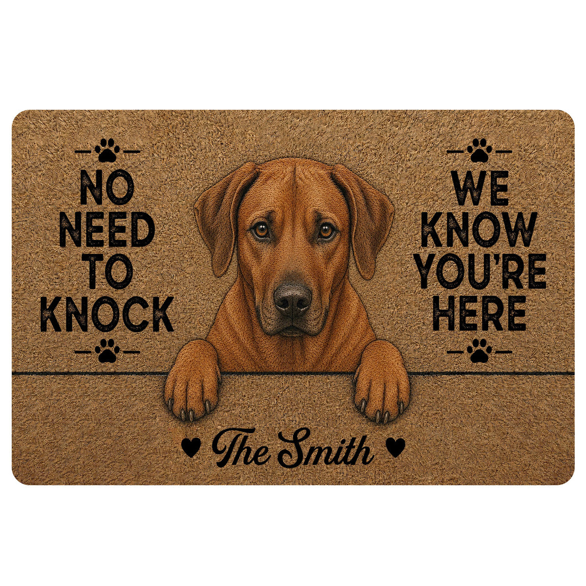Custom family name Rhodesian Ridgeback dog doormat featuring a reddish brown floppy-eared dog peeking over a line, black paw prints, natural coir-look background and No Need to Knock We Know You’re Here quote.