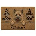 Cairn Terrier doormat with a shaggy dog portrait, paw prints, playful welcome message and warm brown artwork