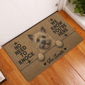 Cairn Terrier entryway rug displayed beside a white door on hardwood flooring