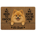 Pomeranian doormat featuring a fluffy tan dog, paw prints, humorous welcome lettering, and a warm brown design