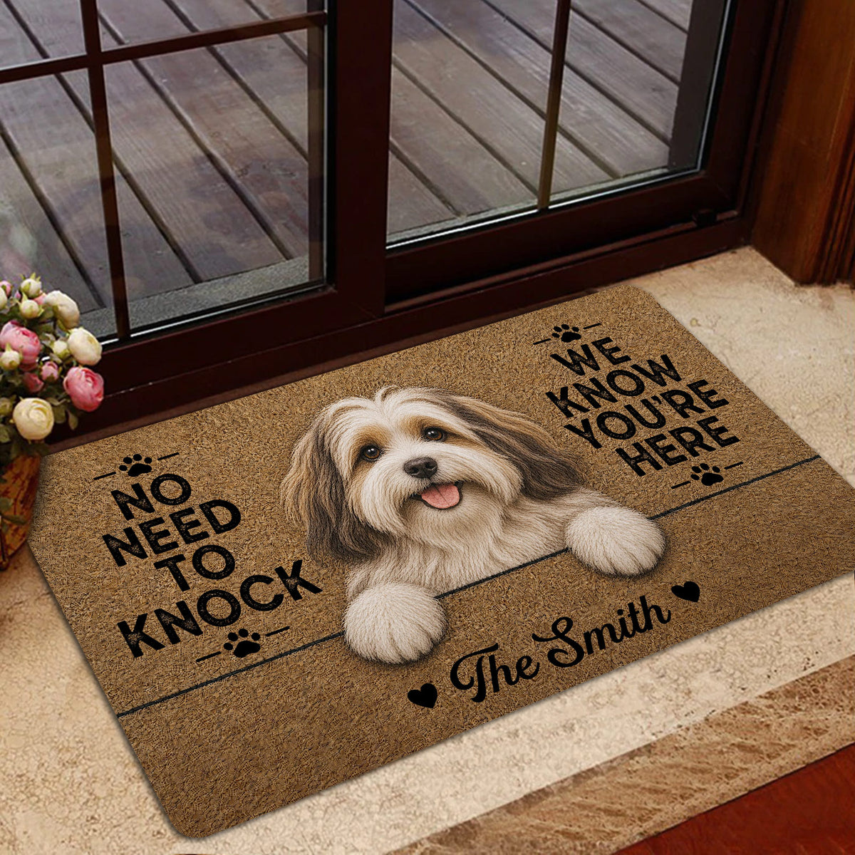 Havanese dog doormat styled at a home entrance with warm wood accents and floral decor