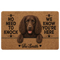 Brown Boykin Spaniel doormat artwork with paw prints, playful welcome message, and warm rustic tones