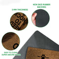 Close-up feature view of the brown dog doormat surface and dark rubber backing