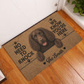Brown Boykin Spaniel doormat styled at an indoor entryway on a warm wood floor