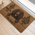 Boykin Spaniel entryway mat displayed beside a doorway on light wood flooring