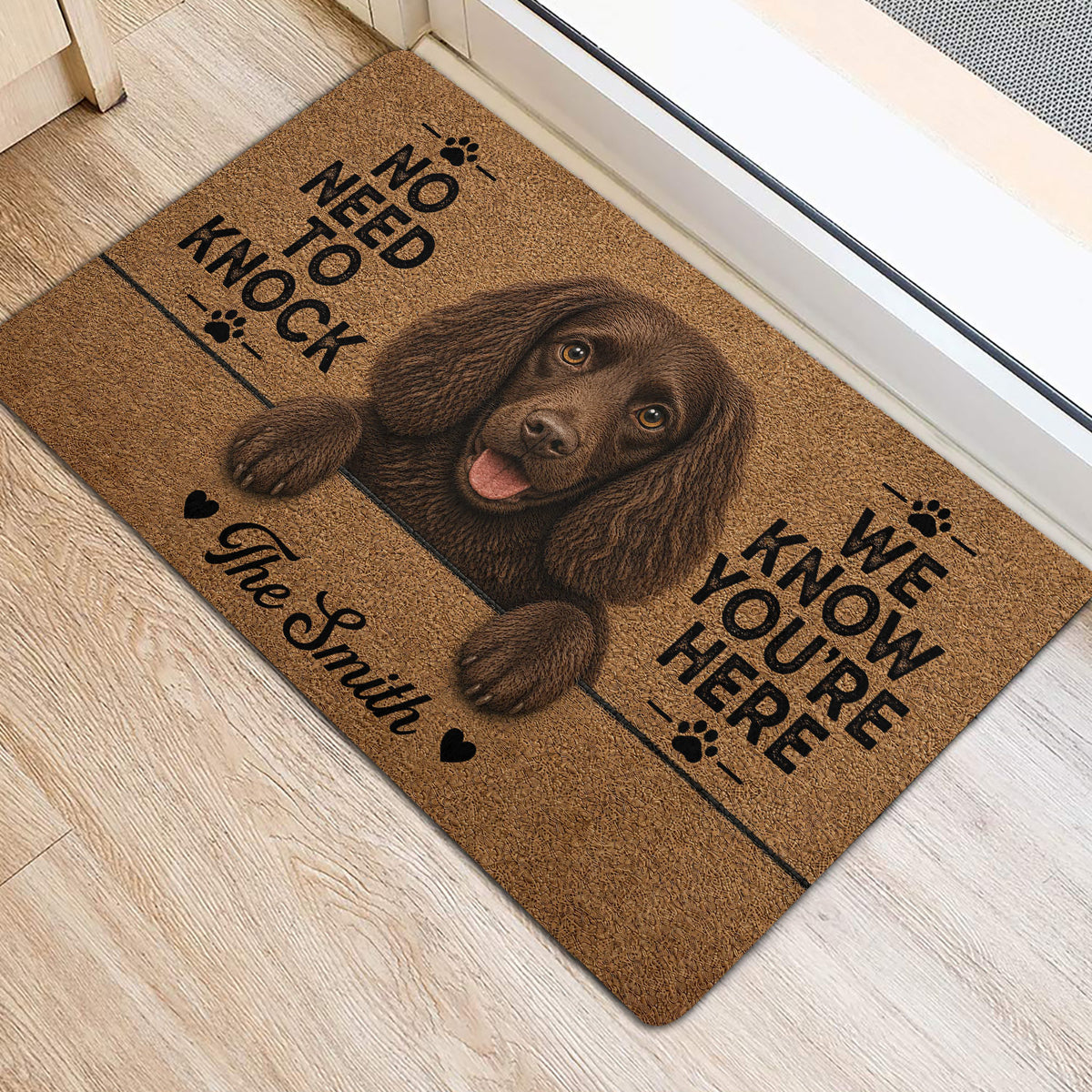 Boykin Spaniel entryway mat displayed beside a doorway on light wood flooring