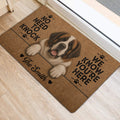 Saint Bernard front door mat with playful lettering, paw prints, and heart accents on light flooring