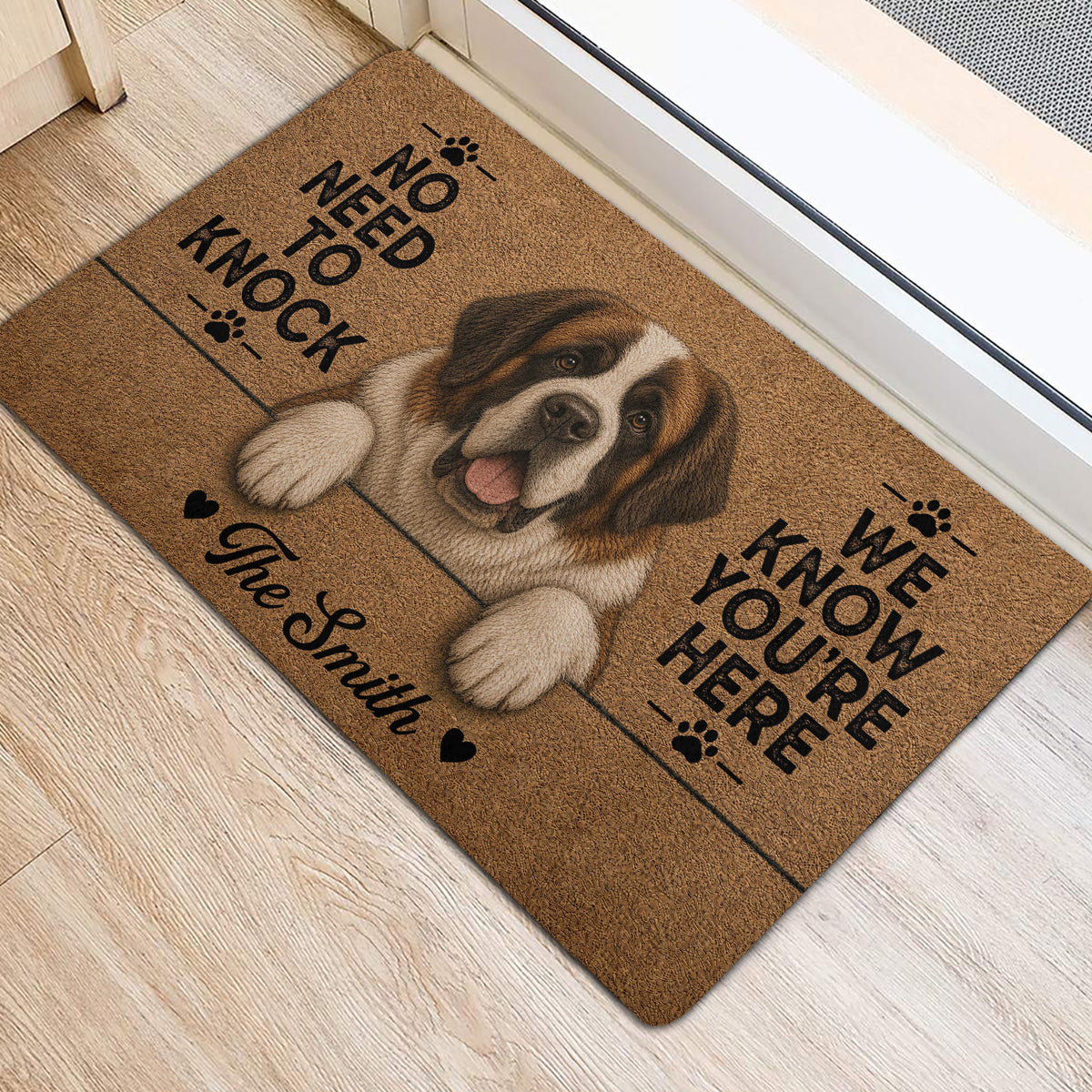 Saint Bernard front door mat with playful lettering, paw prints, and heart accents on light flooring