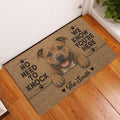 Staffordshire Bull Terrier door mat styled at a front door on wood flooring with a playful dog design