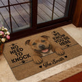 Staffordshire Bull Terrier doormat shown in a home entrance with a friendly dog portrait and playful message