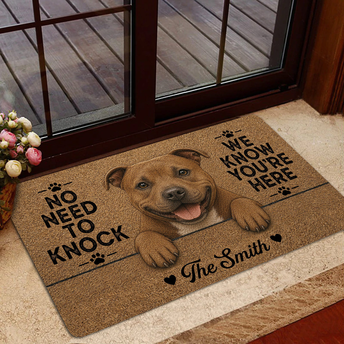 Staffordshire Bull Terrier doormat shown in a home entrance with a friendly dog portrait and playful message