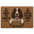 English Springer Spaniel doormat with paw prints, warm brown artwork, and a playful welcome message