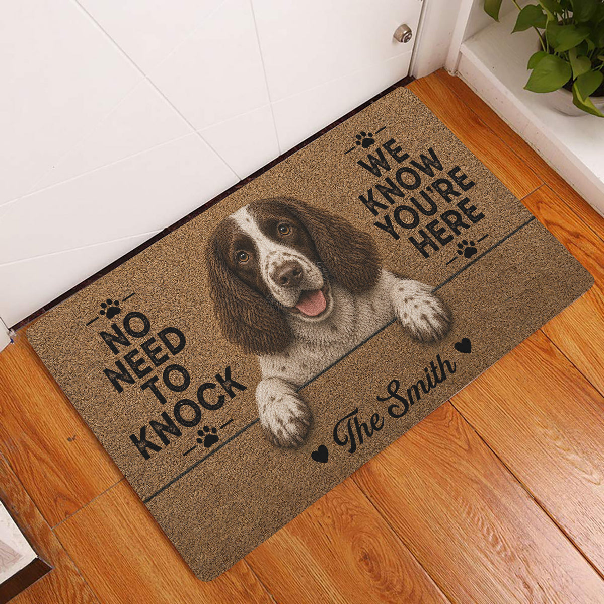 English Springer Spaniel entryway mat displayed by a white door on a hardwood floor