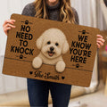Person holding a Bichon Frise doormat featuring a fluffy white dog, paw prints and a cheerful entryway design