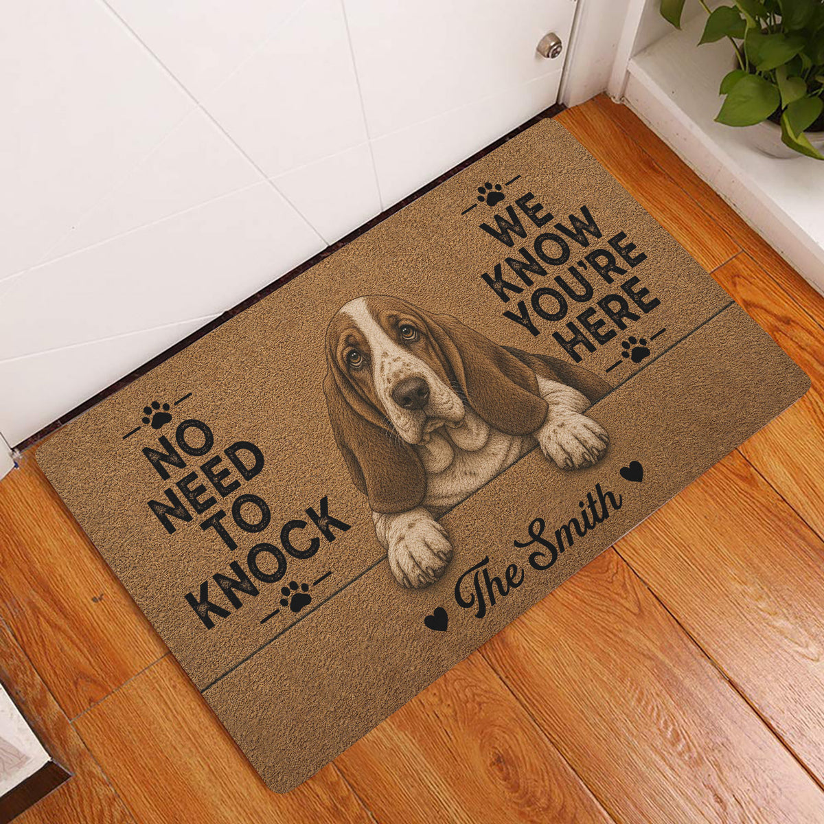 Basset Hound entryway rug displayed beside a front door on warm hardwood flooring
