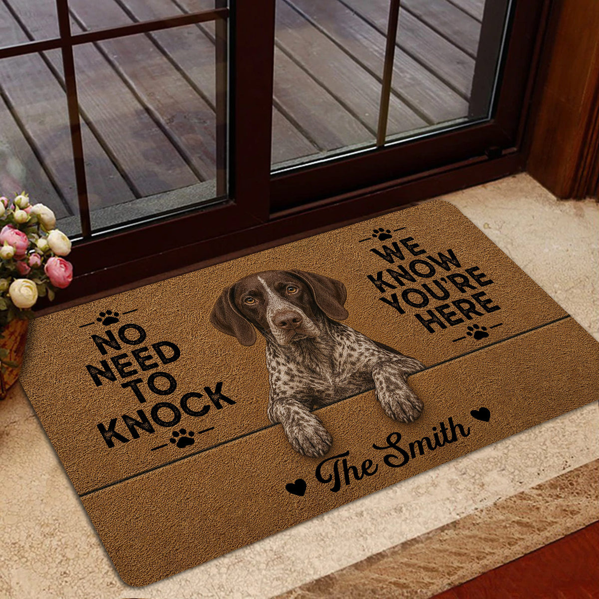 German Shorthaired Pointer rug styled near a glass door with a warm brown design, paw prints, hearts, and playful lettering.