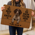 Person holding a German Shorthaired Pointer doormat featuring a realistic dog portrait and humorous welcome message.