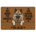 Norwegian Elkhound doormat with a realistic gray dog portrait, paw prints, and warm brown entryway artwork