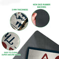 Close-up detail of the camping doormat showing the printed felt surface and dark rubber grip backing