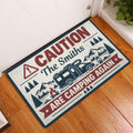 Camping doormat displayed at an indoor doorway with RV, mountain, pine tree and campfire artwork