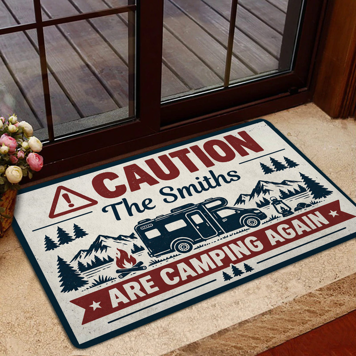 Camping doormat styled inside a glass doorway with vintage RV and mountain campground artwork