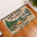 Camping entryway rug displayed on a wood floor beside a door with an RV campsite scene