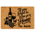 Wine-themed doormat with a bottle, wine glass, grapes, and black welcoming script artwork