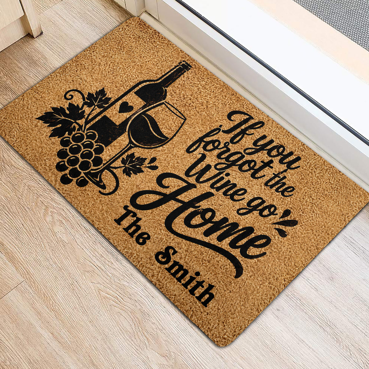 Wine-themed entryway mat placed beside a doorway with bottle, glass, and grape artwork