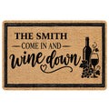 Wine-themed doormat with bottle, wine glass, grapes, and a welcoming script design