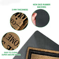 Close-up view of wine doormat surface and black rubber backing detail