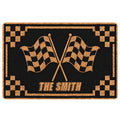 Black and gold motocross doormat featuring crossed checkered racing flags and a bold decorative border