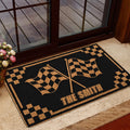 Motocross checkered flag doormat presented in a home entrance with glass doors and warm decor