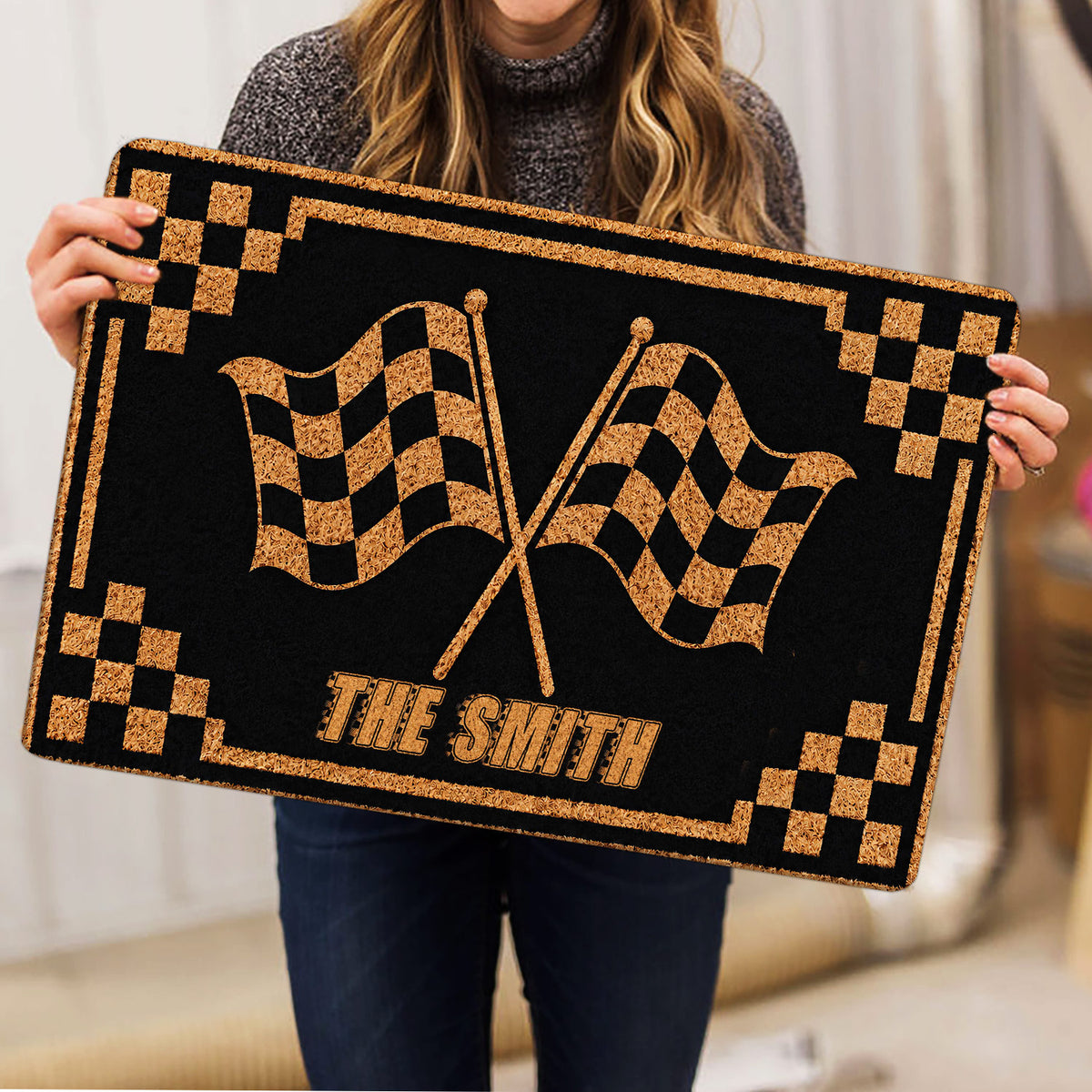 Motocross doormat with crossed racing flags and black and gold border shown in a lifestyle presentation
