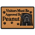 Cane Corso doormat with a black dog portrait, paw prints, and bold tan and black entryway artwork