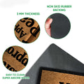 Feature view of the Cane Corso doormat showing its printed tan surface, black edge, and rubber backing