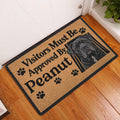 Cane Corso entryway mat displayed on a wood floor beside a door with paw print artwork