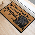 Cane Corso door mat positioned at an entrance, featuring a realistic black dog portrait and paw prints