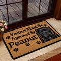 Cane Corso doormat displayed inside a glass doorway with bold black lettering and a dog portrait
